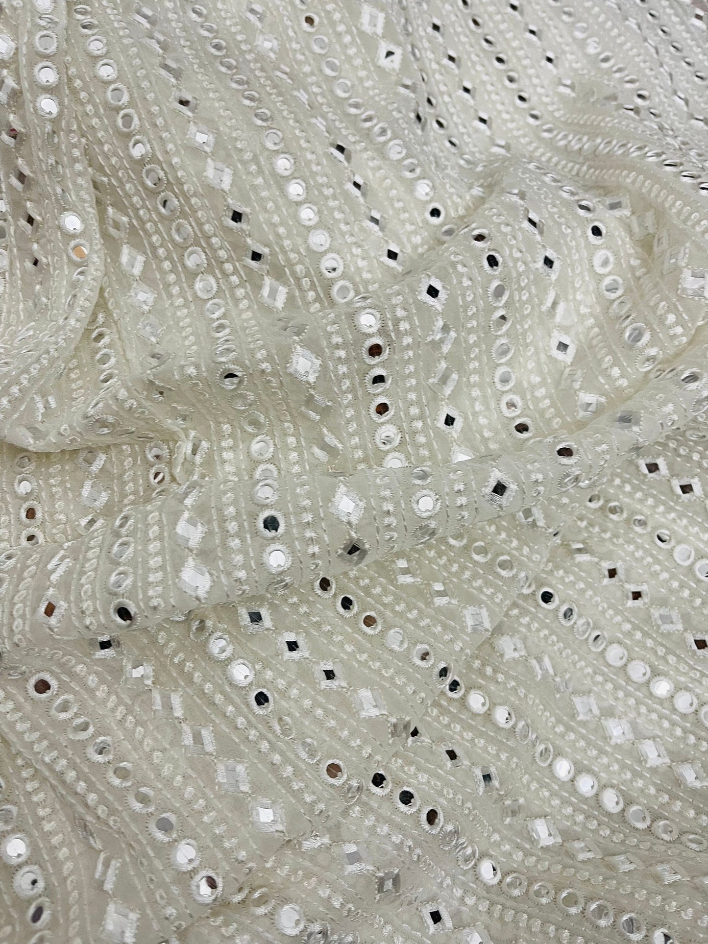 Indian Embroidered Mirror Georgette fabric in Off White color, Multiple lengths will come in the continuous piece - NF485