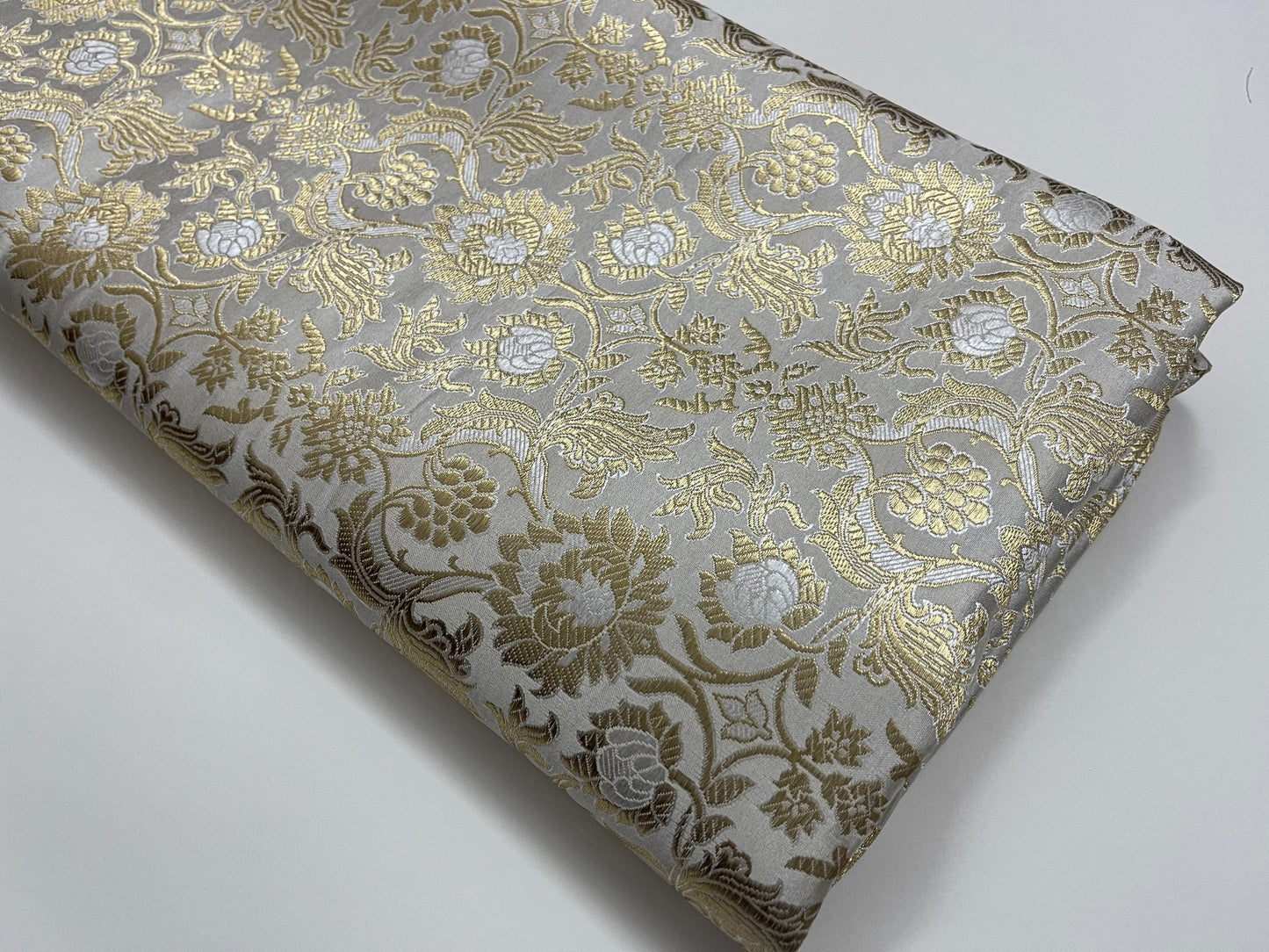 Indian Banarasi Brocade Fabric in White And Gold color, Multiple lengths will come in the continuous piece - NF567