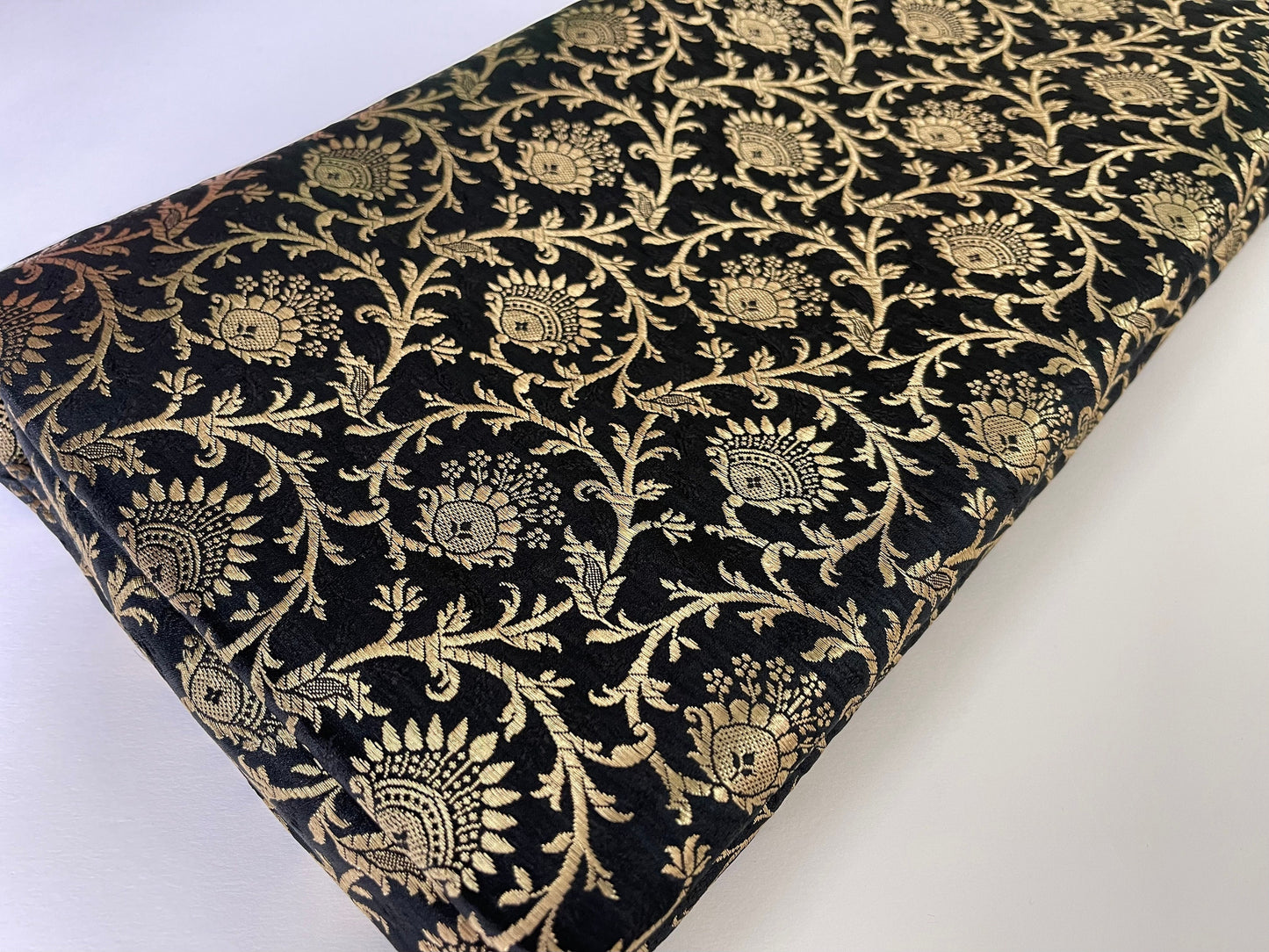 Indian Banarasi Brocade fabric in Black and Gold color, Multiple lengths will come in the continuous piece - NF631